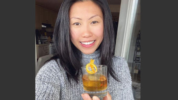 Image of global hospitality professional Evelyn Chick holding a cocktail